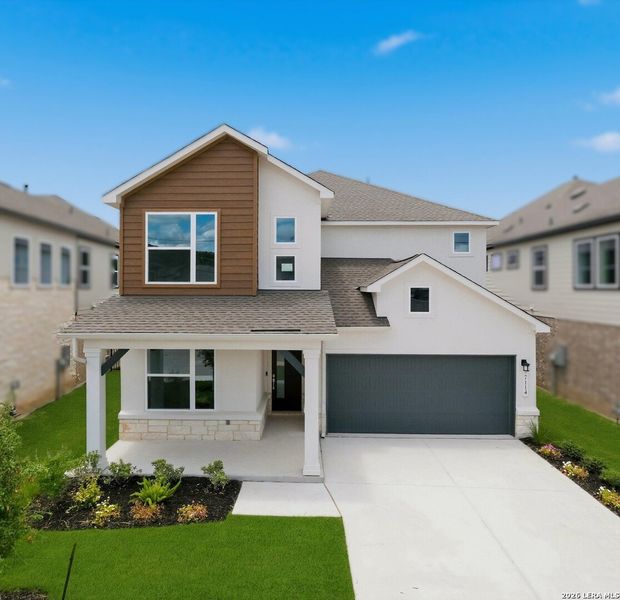 Front exterior of a new home in Crown Ridge Manor, San Antonio, TX, highlighting curb appeal (Image 1). Front exterior of a new home in Crown Ridge Manor, San Antonio, TX, highlighting curb appeal (Image 1).