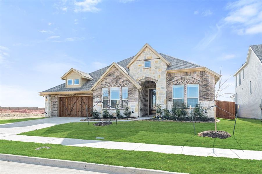 Front exterior of a new home in Villages of Walnut Grove, Midlothian, TX, highlighting curb appeal (Image 26).