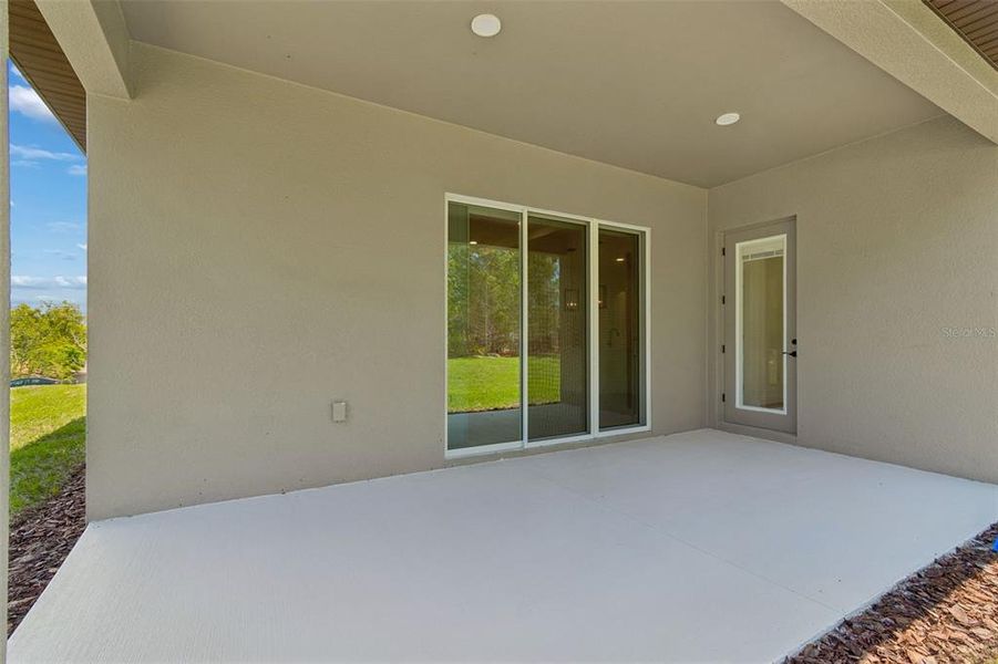 Exterior details and patio area of a home in Royal Highlands, Spring Hill (Image 26).