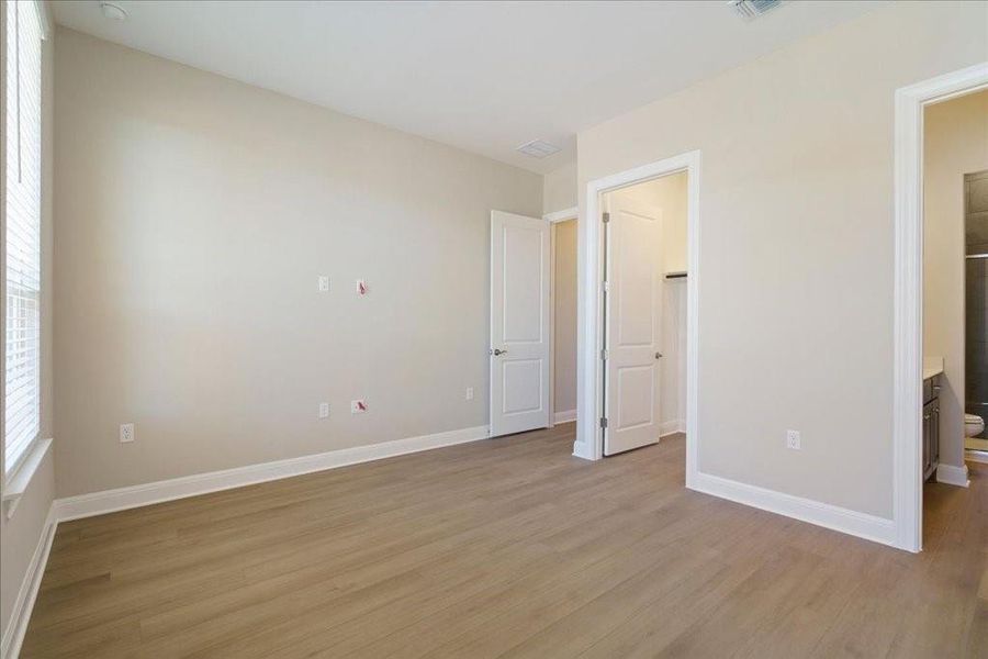 Located at the front of the home, this secondary bedroom overlooks the front yard and has stunning natural light!