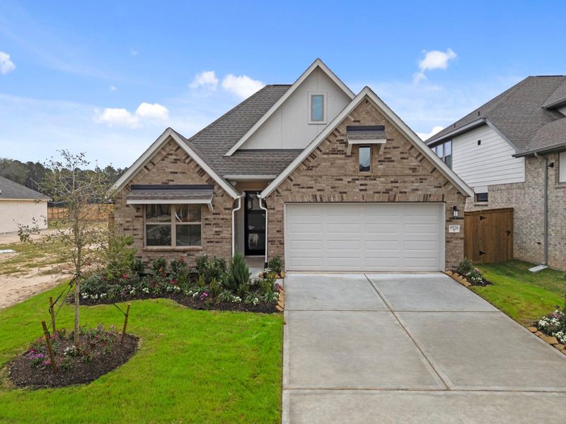 Front exterior of a new home in The Highlands, Porter, TX, highlighting curb appeal (Image 22).