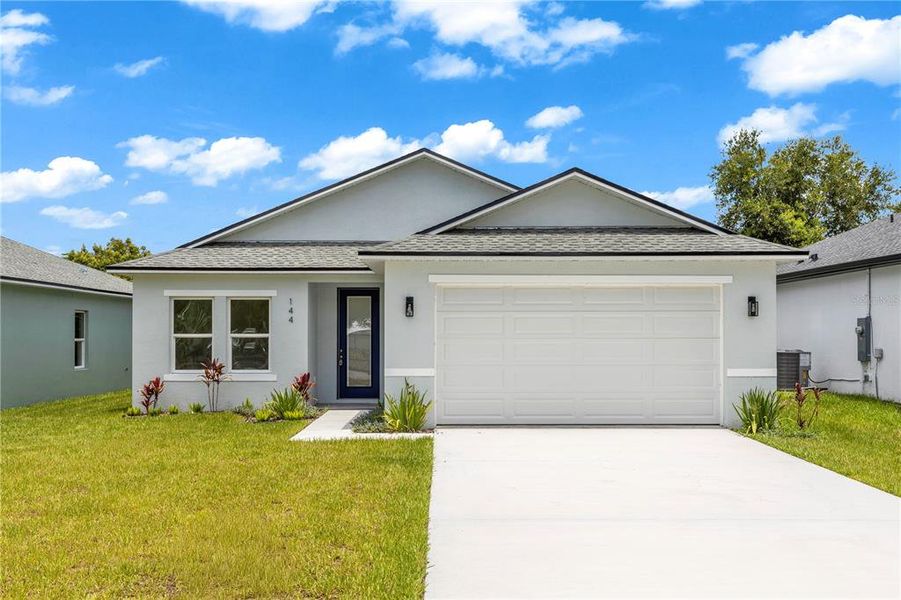 Front exterior of a new home in , Osteen, FL, highlighting curb appeal (Image 20). Front exterior of a new home in , Osteen, FL, highlighting curb appeal (Image 20).