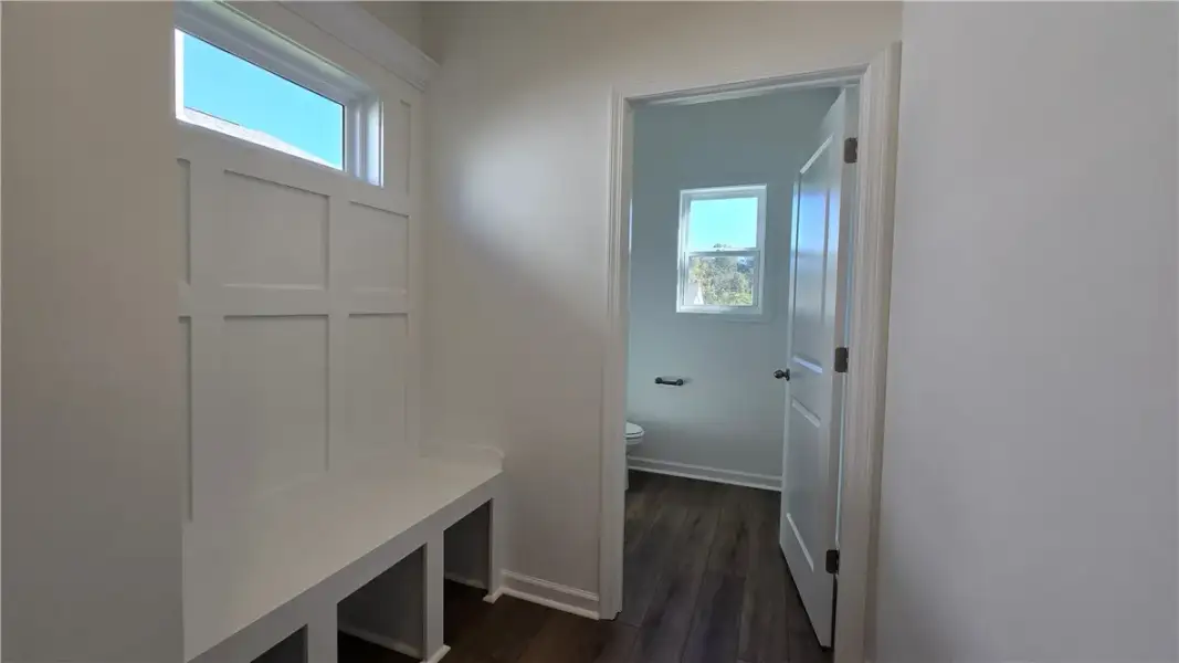 Custom built-in bench seating with wainscoting pan