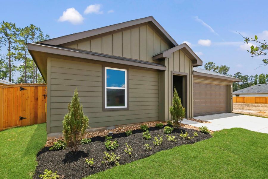 Front exterior of a new home in New Waverly Station, New Waverly, TX, highlighting curb appeal (Image 15). Front exterior of a new home in New Waverly Station, New Waverly, TX, highlighting curb appeal (Image 15).