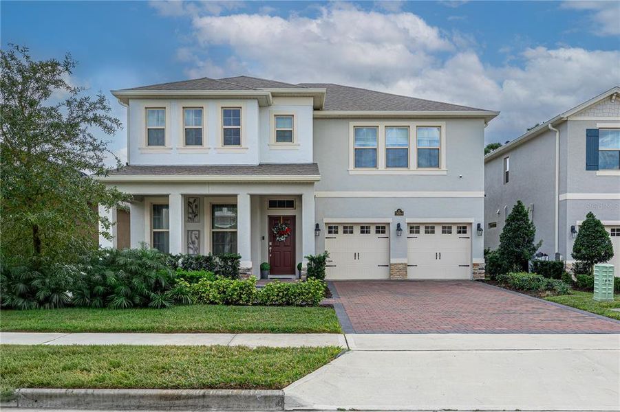 Front exterior of a new home in , Winter Garden, FL, highlighting curb appeal (Image 22).