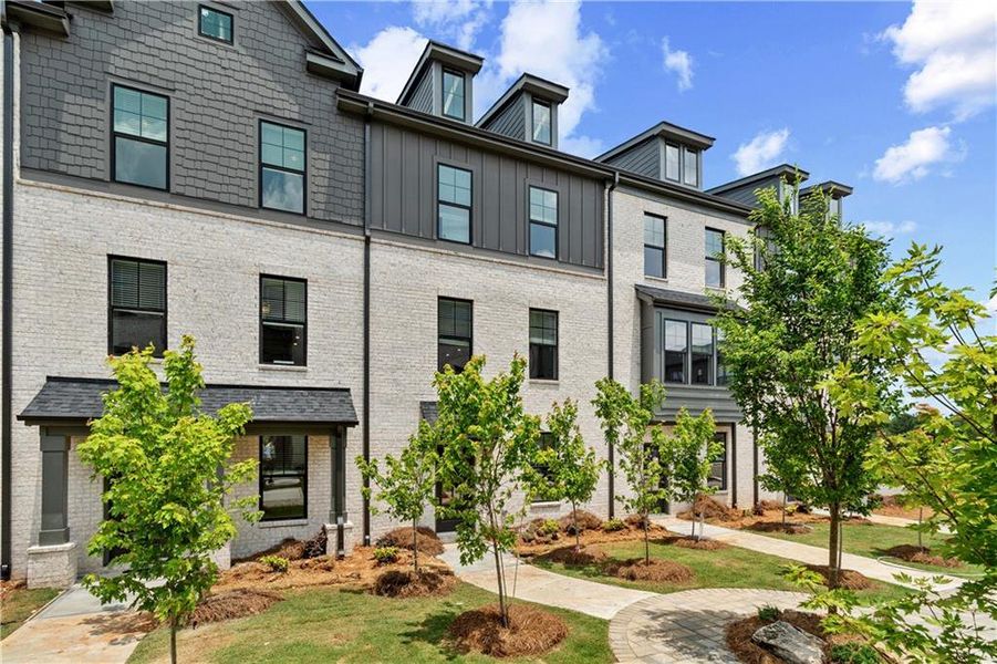 Front exterior of a new home in Silverock, McDonough, GA, highlighting curb appeal (Image 1).