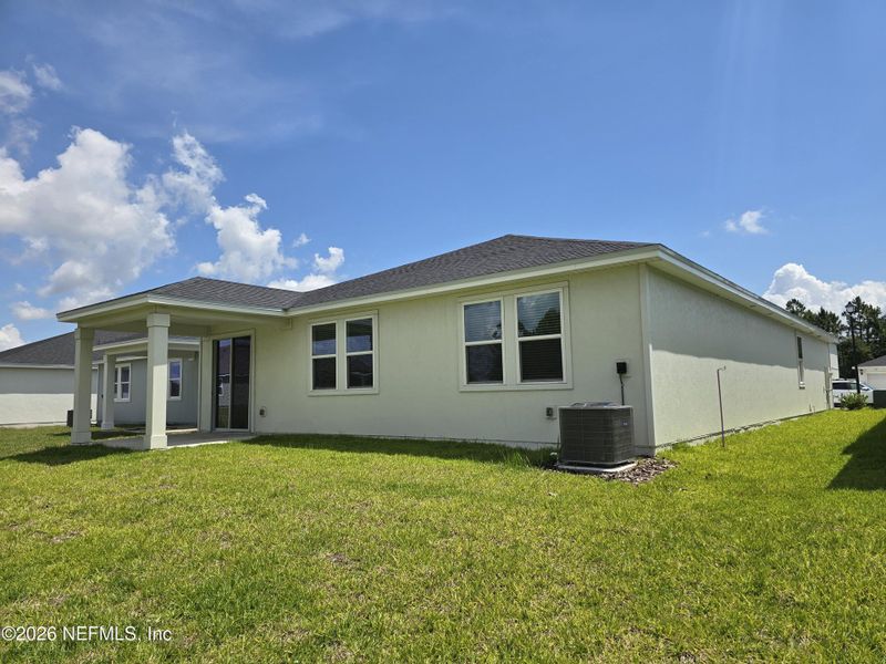 Exterior details and patio area of a home in Lakes at Bella Lago - Signature Series, Green Cove Springs (Image 3). Exterior details and patio area of a home in Lakes at Bella Lago - Signature Series, Green Cove Springs (Image 3).