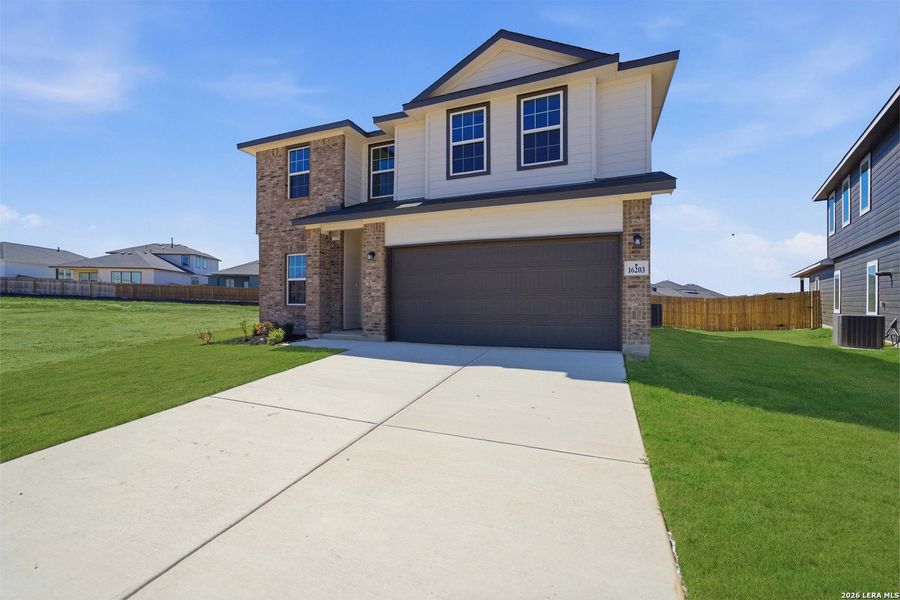 Front exterior of a new home in Hickory Ridge, Elmendorf, TX, highlighting curb appeal (Image 16).