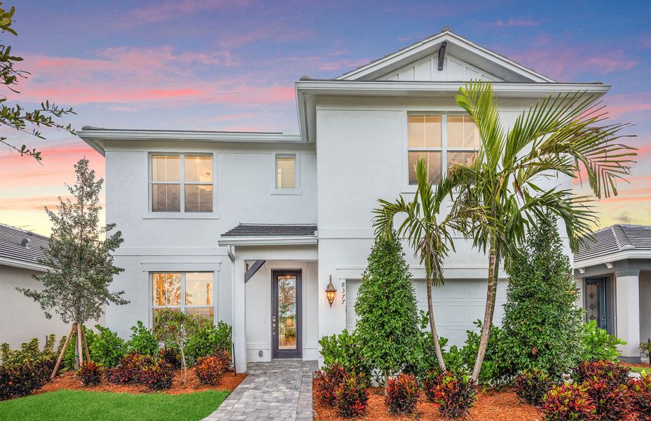 Front exterior of a new home in Harbor Isle, Vero Beach, FL, highlighting curb appeal (Image 1). Front exterior of a new home in Harbor Isle, Vero Beach, FL, highlighting curb appeal (Image 1).