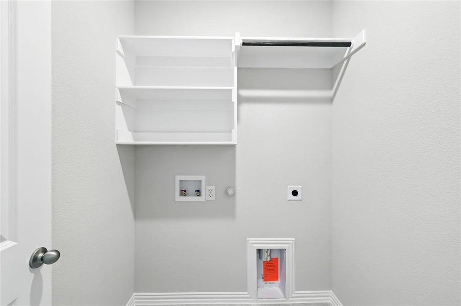 Washroom featuring hookup for a gas dryer, hookup for a washing machine, and electric dryer hookup Washroom featuring hookup for a gas dryer, hookup for a washing machine, and electric dryer hookup