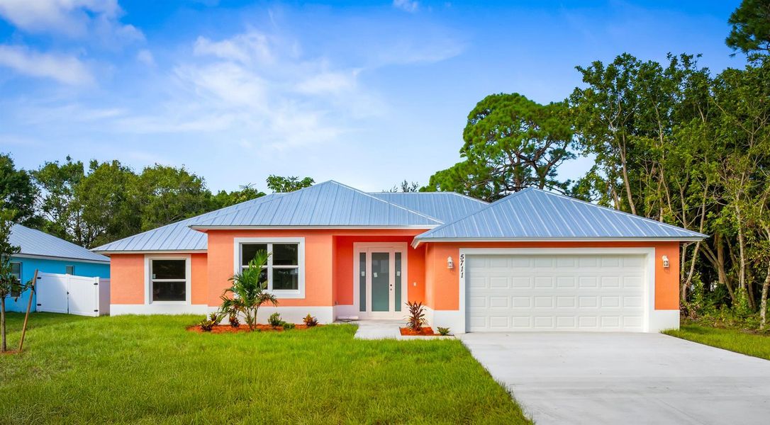 Front exterior of a new home in , Fort Pierce, FL, highlighting curb appeal (Image 1).
