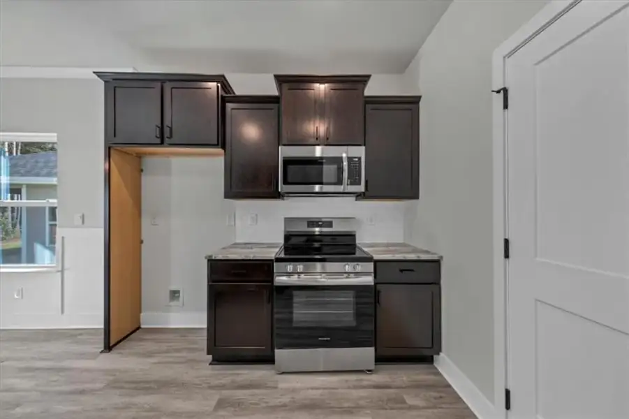 Furnished interior view inside a new home in Canterbury Villas, Carrollton (Image 8).
