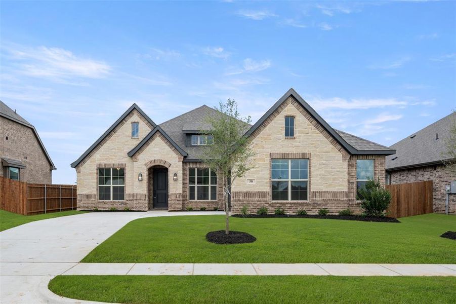 Front exterior of a new home in Mockingbird Hills, Joshua, TX, highlighting curb appeal (Image 19). Front exterior of a new home in Mockingbird Hills, Joshua, TX, highlighting curb appeal (Image 19).