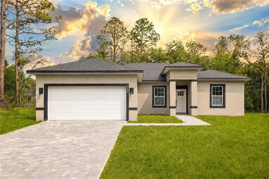 Front exterior of a new home in , Citrus Springs, FL, highlighting curb appeal (Image 1). Front exterior of a new home in , Citrus Springs, FL, highlighting curb appeal (Image 1).