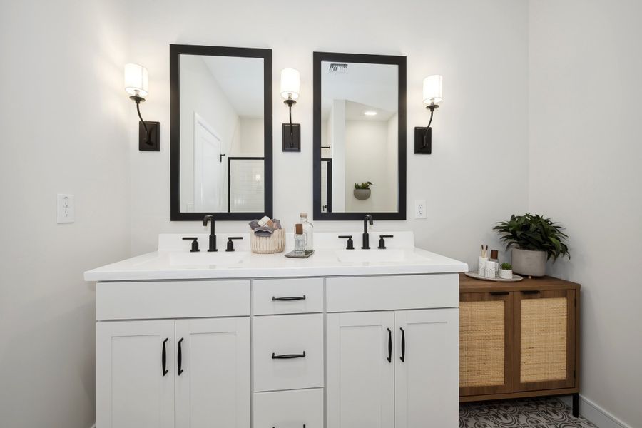 Primary bath with dual sinks and chrome fixtures throughout