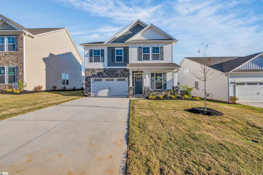 Front exterior of a new home in Halton Oaks, Spartanburg, SC, highlighting curb appeal (Image 15).