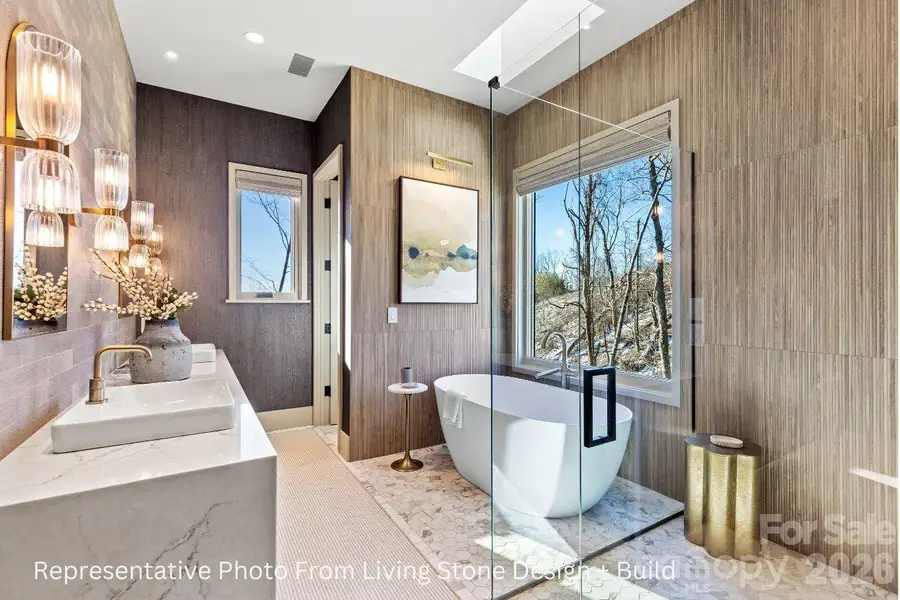 Primary Ensuite. Representative photo from Living Stone Design + Build showing the craftsmanship, quality of construction and finish level. Final design, finishes, and details may vary. Primary Ensuite. Representative photo from Living Stone Design + Build showing the craftsmanship, quality of construction and finish level. Final design, finishes, and details may vary.