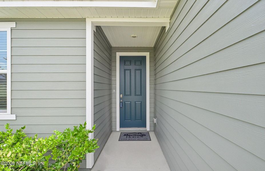 Exterior details and patio area of a home in Lakes at Bella Lago - Signature Series, Green Cove Springs (Image 21).