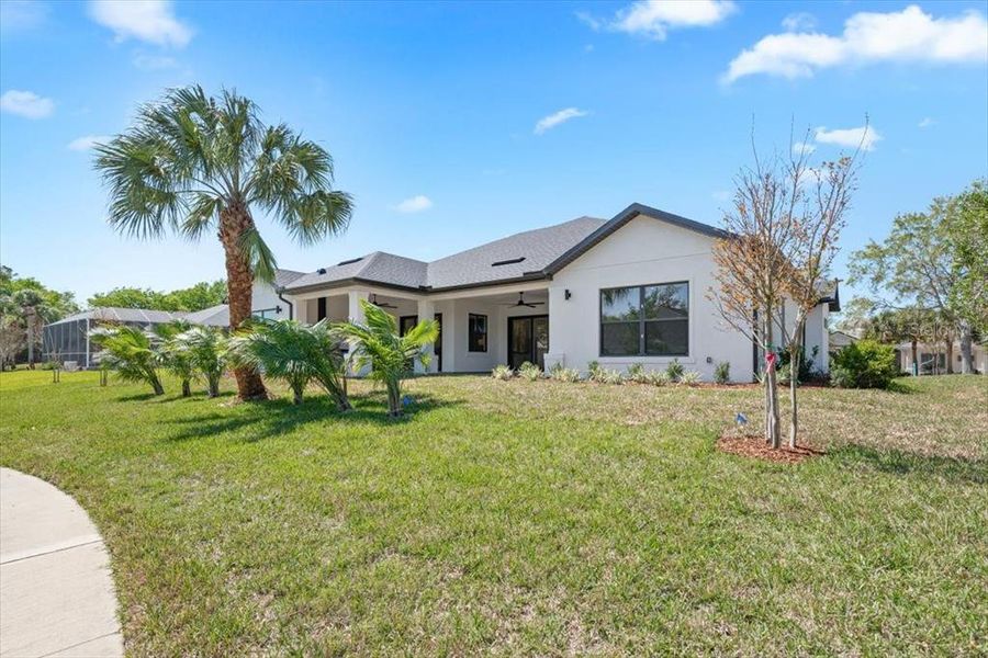 Front exterior of a new home in , Palm Coast, FL, highlighting curb appeal (Image 27). Front exterior of a new home in , Palm Coast, FL, highlighting curb appeal (Image 27).