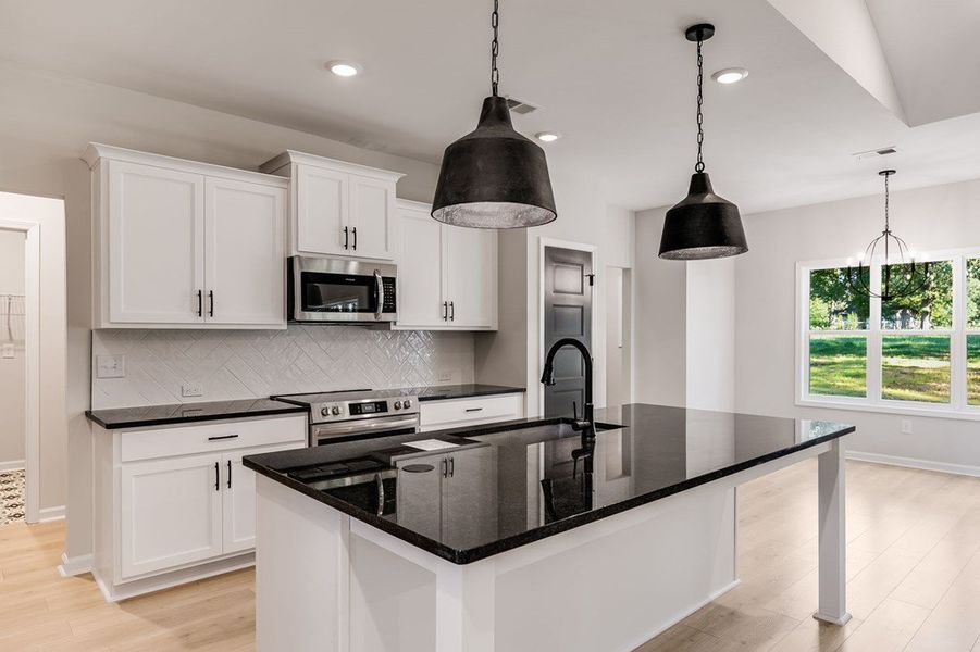 Furnished interior view inside a new home in LOVVORN ESTATES, Carrollton (Image 5).