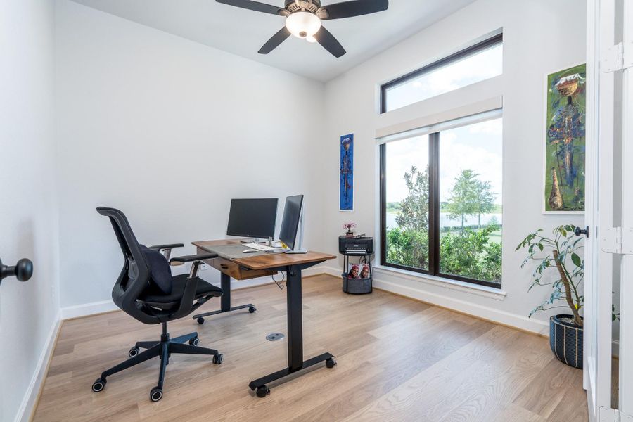 Home office with a remote controlled ceiling fan, remote controlled shade, and a floor electrical outlet so the desk can be placed in the best position for your view of the water. Home office with a remote controlled ceiling fan, remote controlled shade, and a floor electrical outlet so the desk can be placed in the best position for your view of the water.