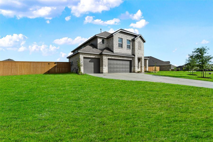 Front exterior of a new home in River Ranch Estates, Dayton, TX, highlighting curb appeal (Image 17). Front exterior of a new home in River Ranch Estates, Dayton, TX, highlighting curb appeal (Image 17).