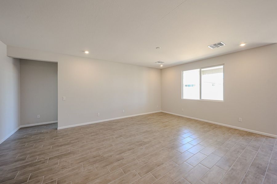 A room with a wood floor and white walls. A room with a wood floor and white walls.