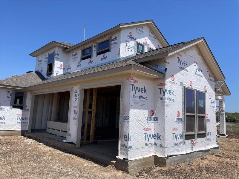 Front exterior of a new home in Leander Estates, Leander, TX, highlighting curb appeal (Image 14).