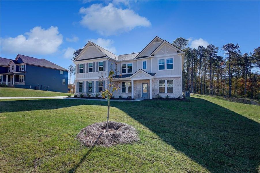 Front exterior of a new home in Riverbend Overlook, Fayetteville, GA, highlighting curb appeal (Image 1).