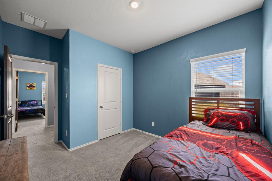 Carpeted bedroom 3 featuring baseboards Carpeted bedroom 3 featuring baseboards