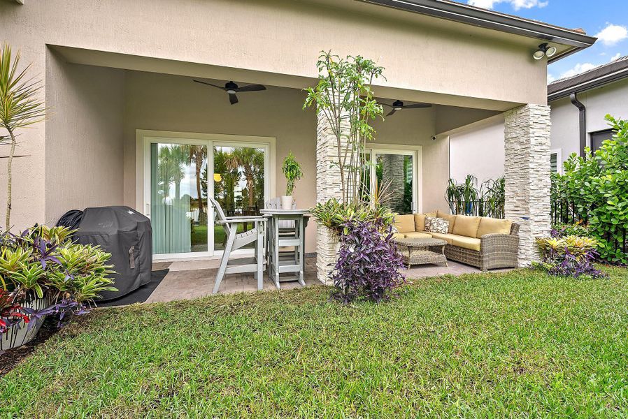 Exterior details and patio area of a home in Avondale at Avenir, Palm Beach Gardens (Image 20).