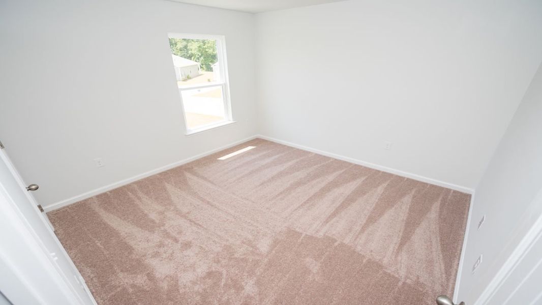 Representative unfurnished interior of a home built from the ROBIE by D.R. Horton in Indigo Preserve, Leland (Image 27).