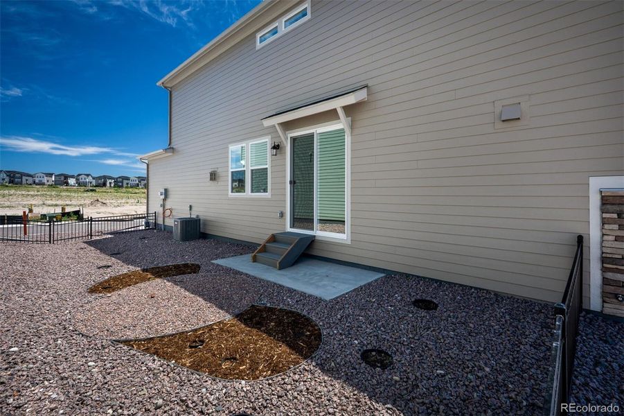 Front exterior of a new home in Revel Crossing at Wolf Ranch – The Ascent Collection, Colorado Springs, CO, highlighting curb appeal (Image 20).