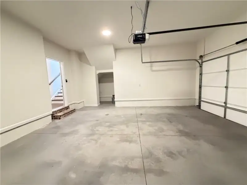 oversized garage with additional under-stair storage *Images shown are from a different homesite featuring the Aspen Floor Plan. Design selections and colors will vary by home. *