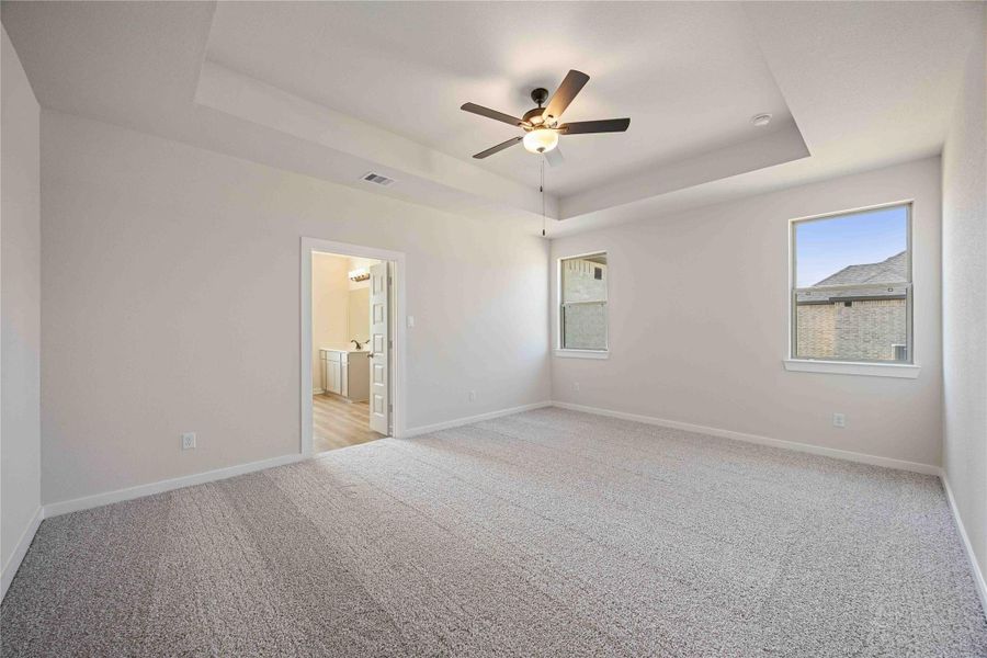 The luxurious owner's retreat is a private oasis with a spa-inspired bath and an extended walk-in closet.