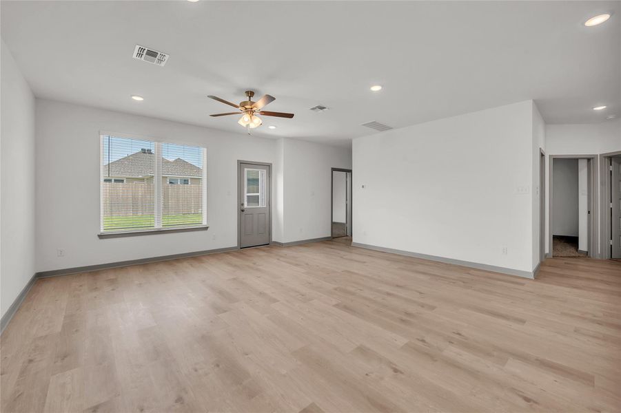 Unfurnished living room featuring recessed lighting, light wood finished floors, and a ceiling fan