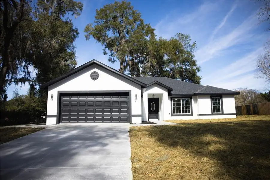 Front exterior of a new home in , Ocala, FL, highlighting curb appeal (Image 2). Front exterior of a new home in , Ocala, FL, highlighting curb appeal (Image 2).