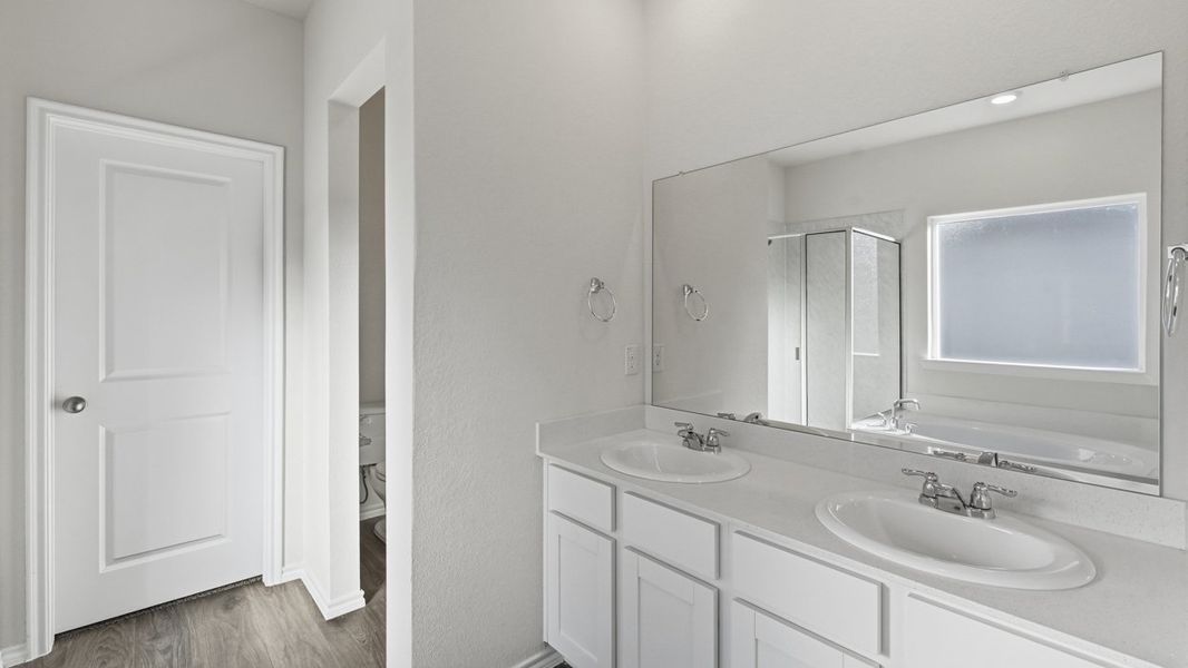 Representative furnished interior of a home built from the Mercury by D.R. Horton in Windrose, Pilot Point (Image 6).