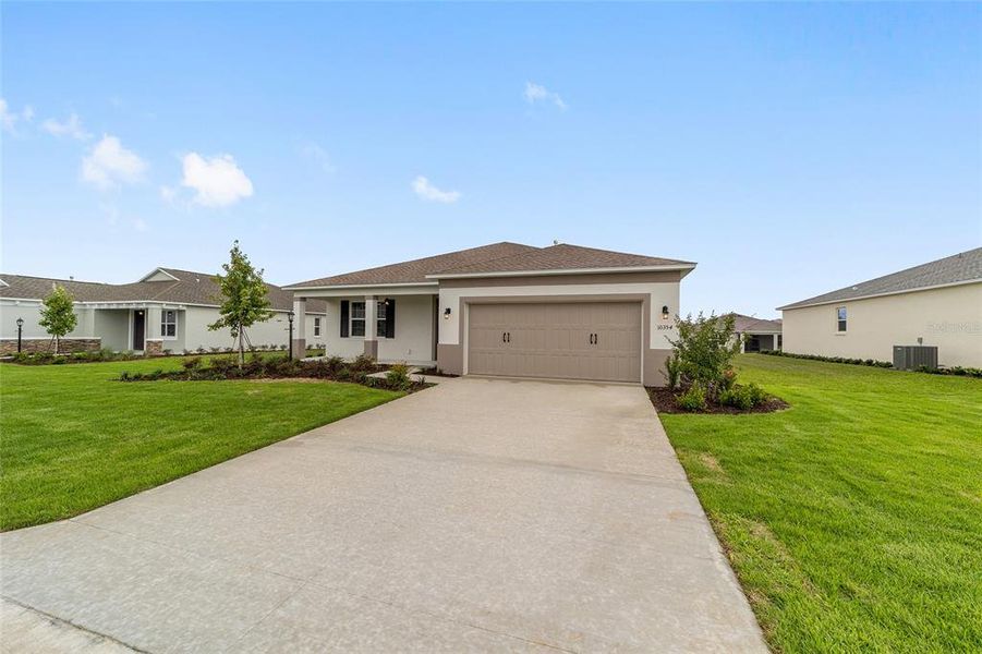 Front exterior of a new home in , Ocala, FL, highlighting curb appeal (Image 1). Front exterior of a new home in , Ocala, FL, highlighting curb appeal (Image 1).