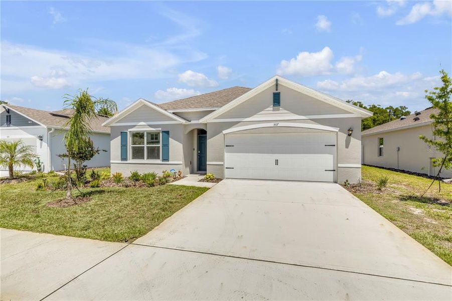 Front exterior of a new home in , New Smyrna Beach, FL, highlighting curb appeal (Image 32).