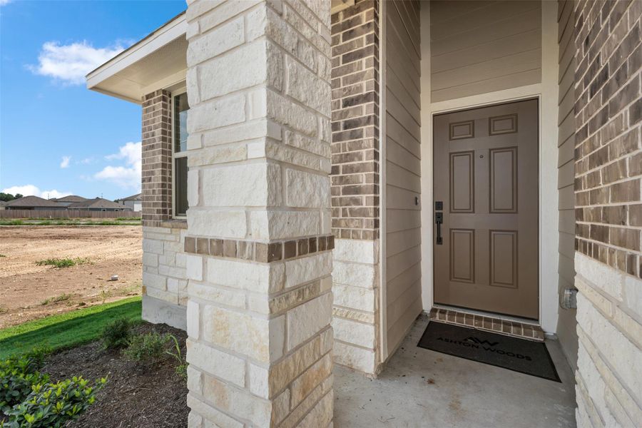 Front exterior of a new home in Rolling Glen, Hutto, TX, highlighting curb appeal (Image 23). Front exterior of a new home in Rolling Glen, Hutto, TX, highlighting curb appeal (Image 23).