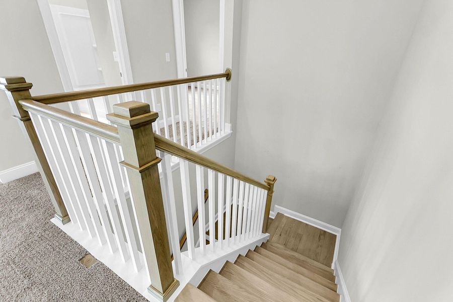 Spacious, unfurnished interior of a new home in Tidewater at Lakes of Cane Bay, Summerville (Image 32).