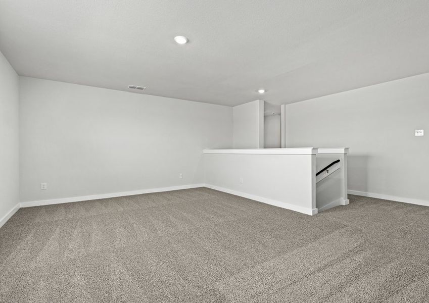 Upstairs, the gameroom loft is an extended, versatile living space.