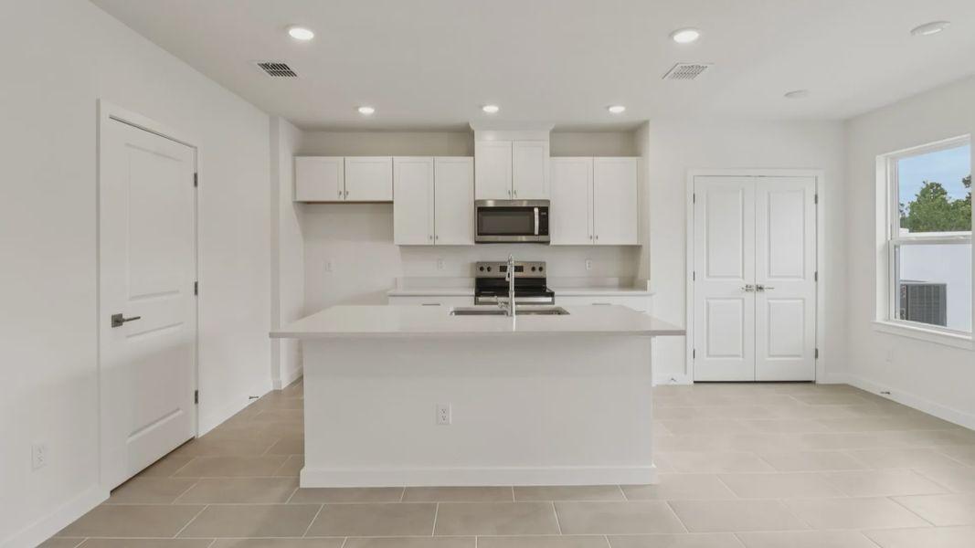 Furnished interior view inside a new home in Cyrene at Harmony, St. Cloud (Image 9).