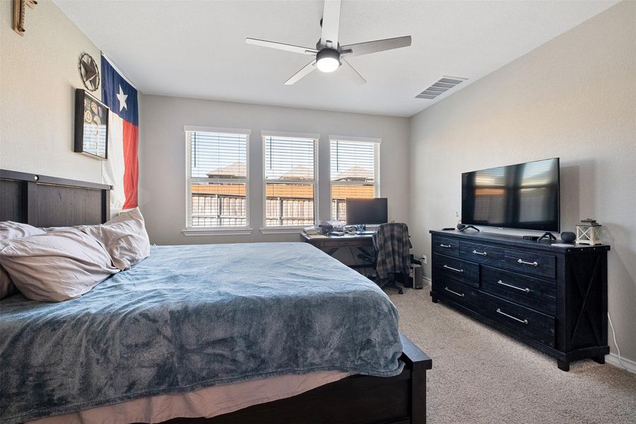 Spacious Primary bedroom with lots of natural light