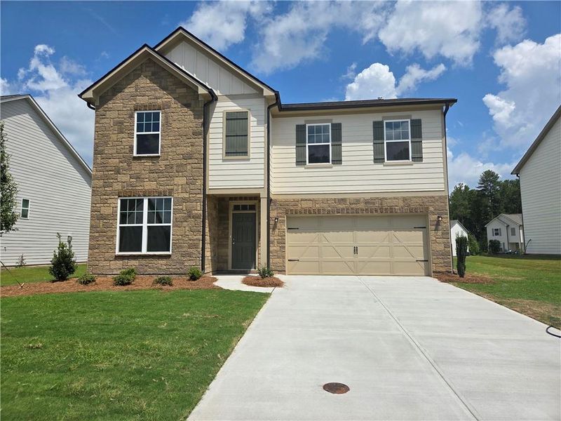 Front exterior of a new home in , Locust Grove, GA, highlighting curb appeal (Image 1). Front exterior of a new home in , Locust Grove, GA, highlighting curb appeal (Image 1).