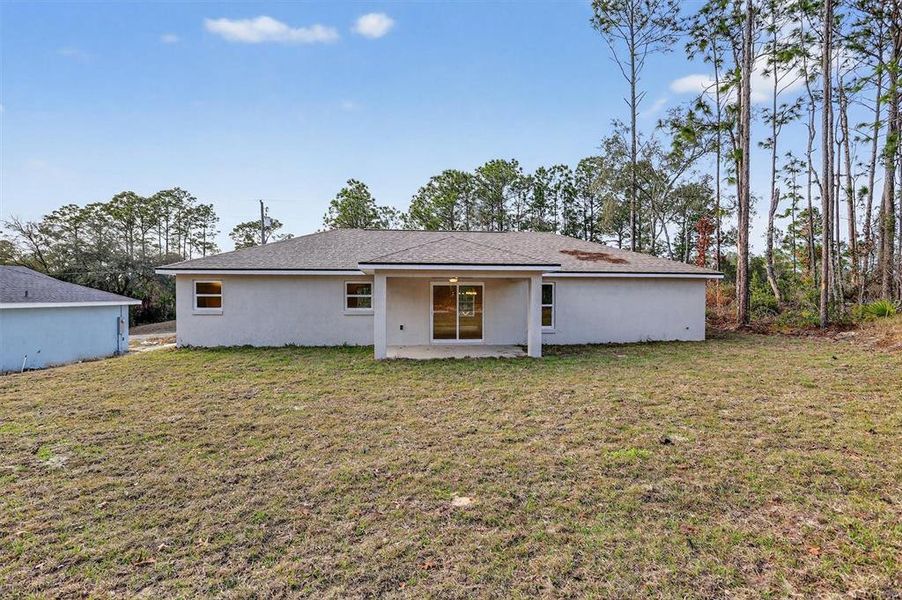 Exterior details and patio area of a home in , Citrus Springs (Image 24).