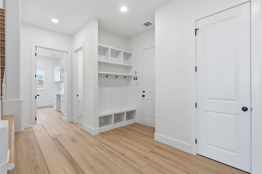 Mudroom from garage area. Photos are of prior LOTUS plan homesite built by Aurcova. Mudroom from garage area. Photos are of prior LOTUS plan homesite built by Aurcova.