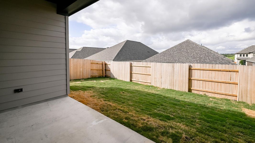 Exterior details and patio area of a home in Crosswinds, Kyle (Image 4).