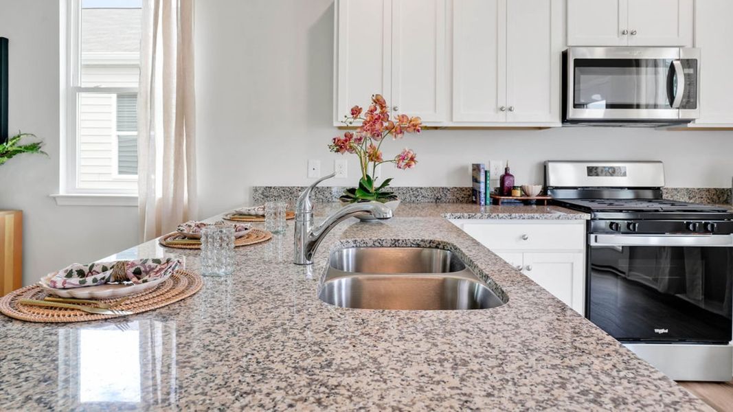 Representative furnished interior of a home built from the LEWIS by D.R. Horton in The Cottages at Blake Farm, Wilmington (Image 21).